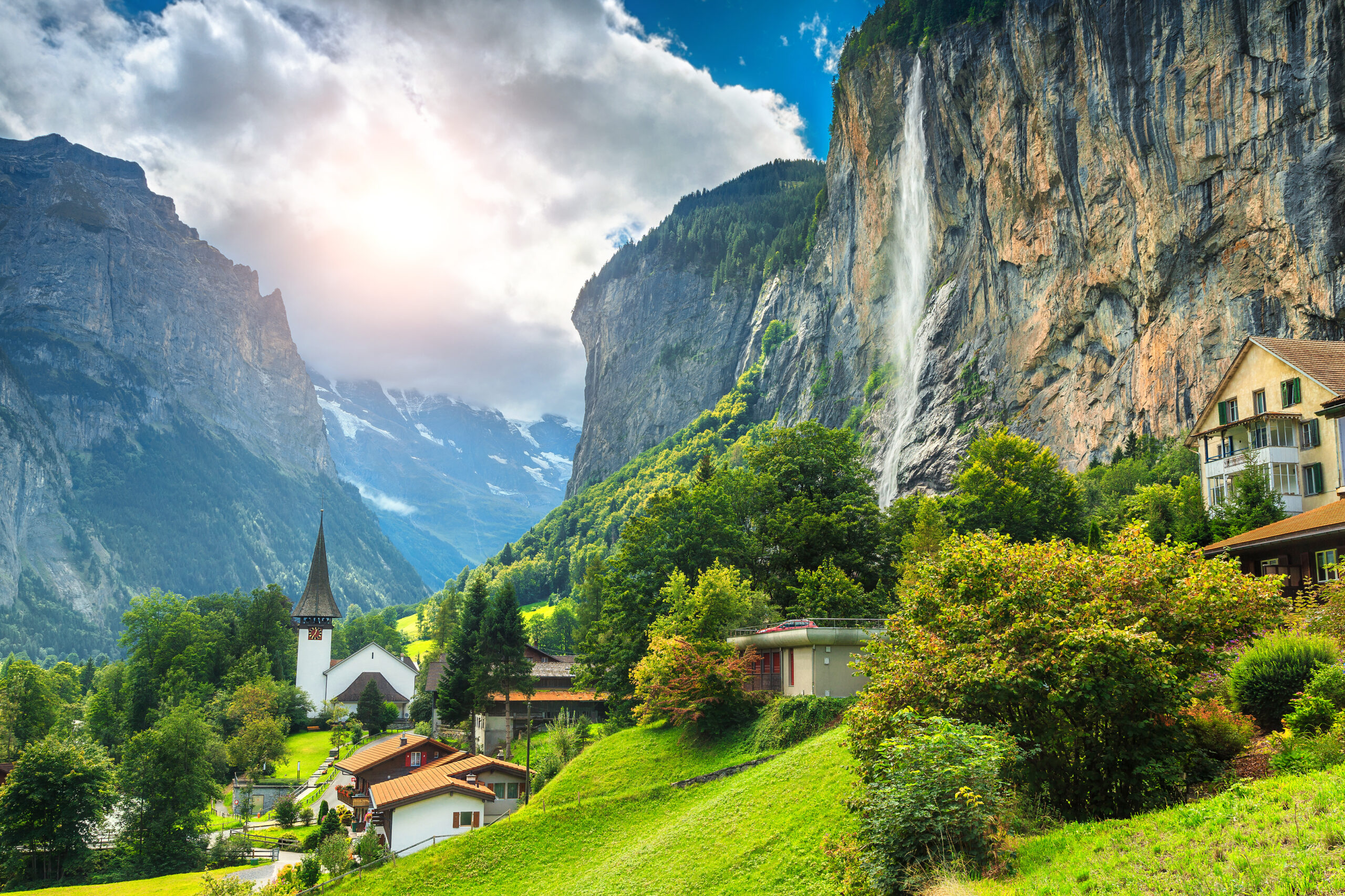 swiss-fixer-swixer-local-production-services-in-switzerland-mountain-village-with-high-cliffs-and-waterfalls
